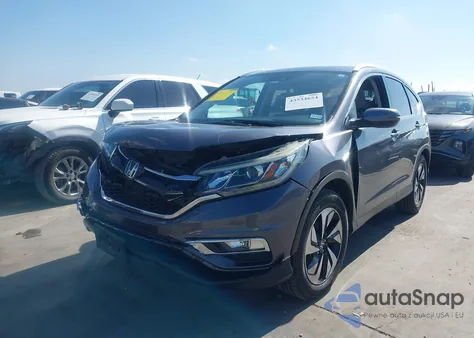 2016 Honda Cr-V Touring z USA, uszkodzony, nr VIN 5J6RM3H95GL025401